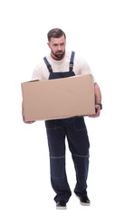 in full growth. a smiling man with cardboard boxes on his shoulders