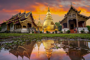 Wat Phra Singh Temple in twilight time and reflection. Beautiful traditional architecture at Temple Of Chiangmai Thailand, Asia.