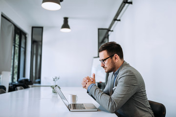Fototapeta premium Serious businessman in office environment.