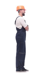 in full growth. smiling man in overalls and a safety helmet