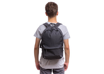 Student teen boy with backpack - back view. Portrait of cute schoolboy with hands in pockets, isolated on white background. Happy child Back to school - rear view. - 282415017