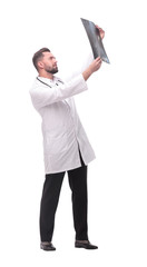 in full growth. medical doctor looking closely at the x-ray