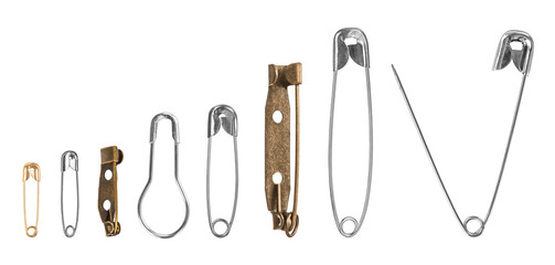 Collection of safety pins on isolated white background