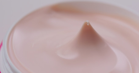 Pink cosmetics lotion close up