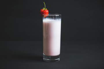 Strawberry milkshake with on the rustic background. Selective focus. 
