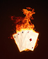 Playing cards' aces on fire glowing