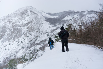 Fototapeta na wymiar Man in the snowy mountains