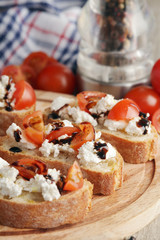 Sandwiches with tomatoes, homemade cheese, olive oil and balsamic sauce