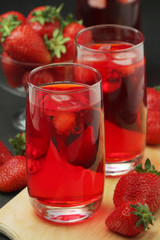 Glasses with strawberry drink with ice