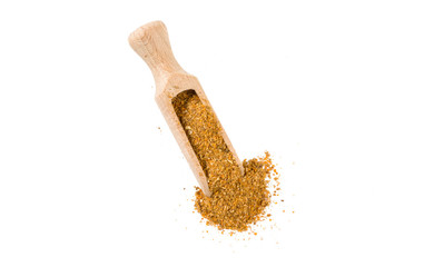herb or herbal pepper mix in wooden scoop isolated on white background. top view. spices and food ingredients.