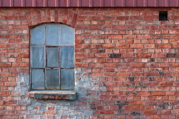 Fototapeta na wymiar old window on brick wall