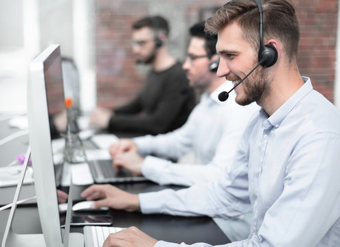employees with a headset in the workplace in the business center