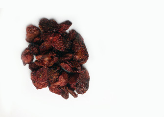 a pile of dried strawberry on white background