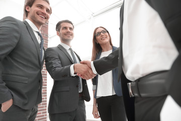 Business shaking hands in the office