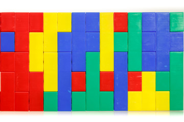 Children's colorful plastic construction toy bricks on white