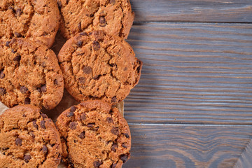 Chocolate oatmeal chip cookies on the rustic wooden table. Flat lay