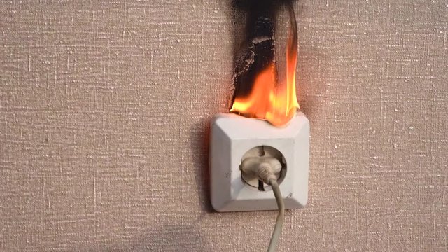 Fire in the power outlet. Old faulty wiring. The occurrence of a fire in the apartment. Old faulty wiring caught fire from a short circuit in the outlet. episode ...
