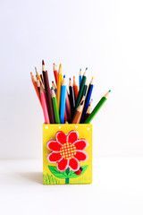 Fototapeta premium Colored pencils in a pencil case on white background