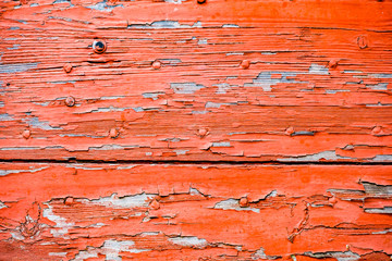 Arrière plan bois et peinture rouge écaillée