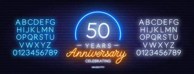 Fifty years anniversary neon sign on a dark background. Neon alphabet . Template for invitation or greeting card.