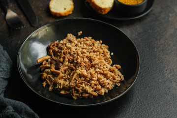 buckwheat porridge with mushrooms. food background. top view. copy space