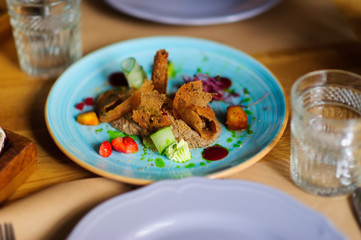Beautiful served food on plates in restaurant