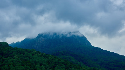 Obraz na płótnie Canvas A mountain range under thunderclouds. Russia, Karachay-Cherkessia