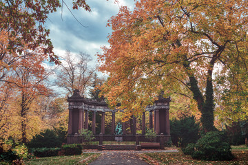 monument in a autumn park. Unknown artist of the 19th century.