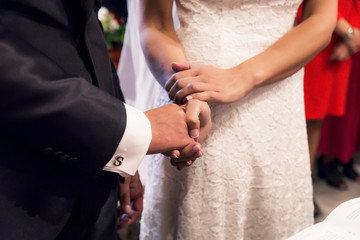 holding hands during the wedding