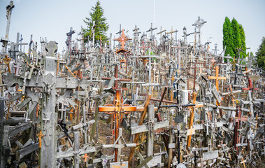 SIAULIAI, LITHUANIA - JULY 28, 2019:A large number of wooden crosses and crucifixes at the Hill of Crosses