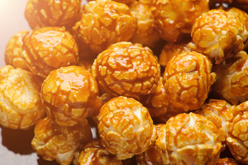 sweet Caramel Cream popcorn on the black background
