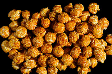 sweet Caramel Cream popcorn on the black background