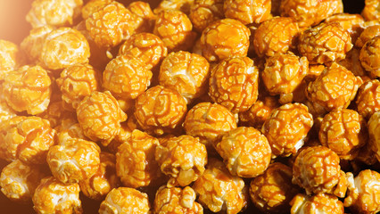 sweet Caramel Cream popcorn on the black background