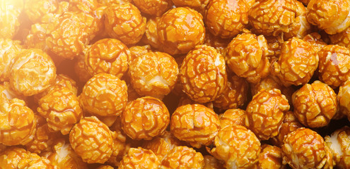sweet Caramel Cream popcorn on the black background