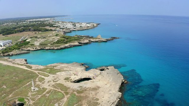 Aerial view, flight at Tower and bay of Roca Vecchia (Torre di Maradico), archaeological sites, Brindisi region, Apulia Italy