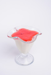 Close up photograph of a fancy panna cotta with strawberries