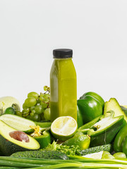 Vegetable smoothie in composition with raw vegetables and green fruits. Healthy eating concept