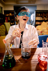 funny female scientist in chemical laboratory