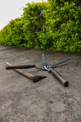 Garden tools, Hedge clipper and ax are waiting for their use, Orchha, India