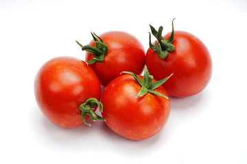 ripe fresh tomatoes isolated on white background