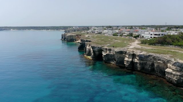 Aerial view, flight at Tower and bay of Roca Vecchia (Torre di Maradico), archaeological sites, Brindisi region, Apulia Italy