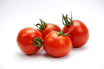 ripe fresh tomatoes isolated on white background