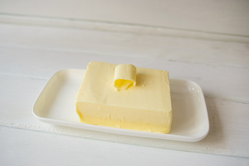 piece of butter on a wooden desk