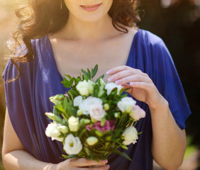 happy beautiful woman with bouquet of flowers