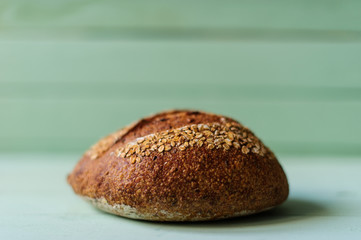 traditional bread loaf on lime wooden board