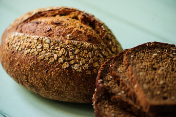 traditional bread loaf on lime wooden board