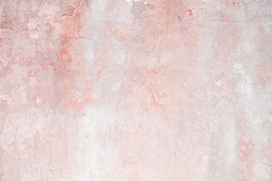 Old distressed pink wall background or texture