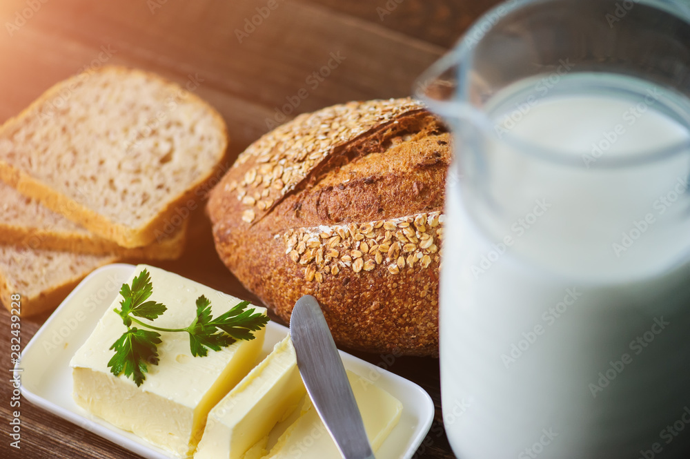 Wall mural traditional bread loaf on lime wooden board