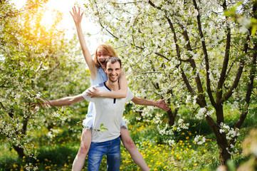 Young couple have fun in the garden