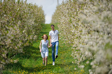 Fototapeta premium Young couple have fun in the garden